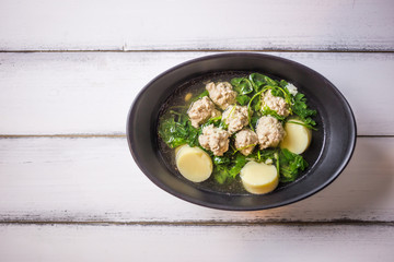 Ivy Gourd soup with pork on wooden background, Thai local food, Tofu Soup