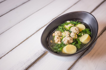 Ivy Gourd soup with pork on wooden background, Thai local food, Tofu Soup