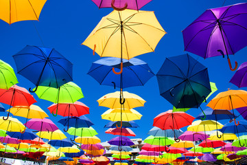 Fototapeta na wymiar Multicolor umbrellas. Street art. Puerto Banus city, Marbella, Andalusia, Spain.