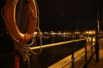 Orange life ring in front of dock