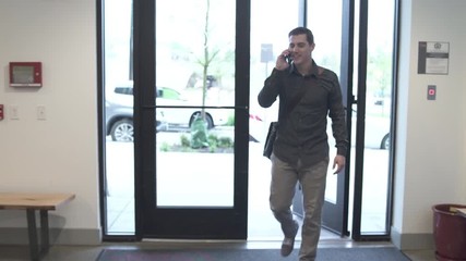 Tracking shot of a man taking the elevator