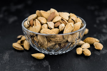 Slate slab with roasted Almonds (in the shell)