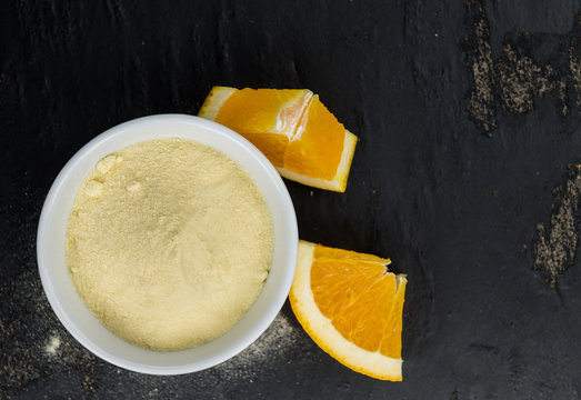 Orange fruit powder on a slate slab