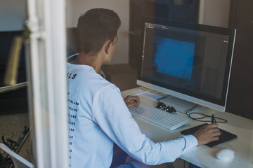 young working with the computer at home or in the office