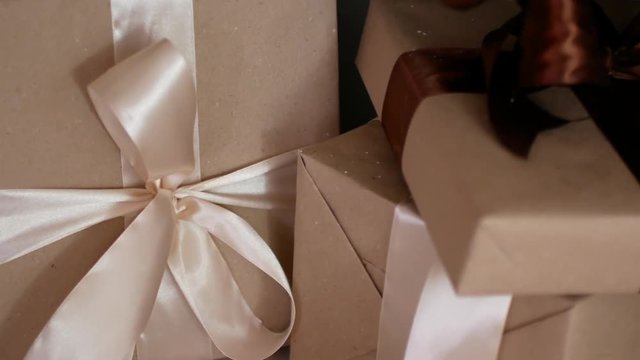 New Year gifts under the Christmas tree. Posting Christmas ornaments