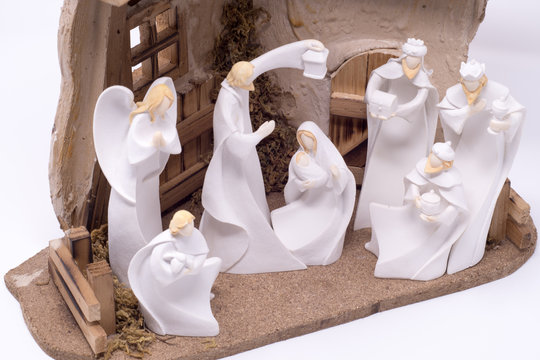 A nativity set depicting the three wise men visiting Jesus set against a clean white background