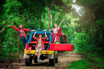 Fototapeta na wymiar Group of People Hiking and Traveling for Camping in the Forest with 4WD Road Trip in Weekend Summer - Travel and Recreation Concept