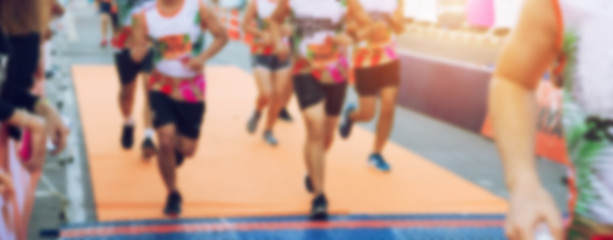 Blurred Group of Runner are Running in Marathon Event for Background , Banner , Ads - Lifestyle Sport Recreation Concept