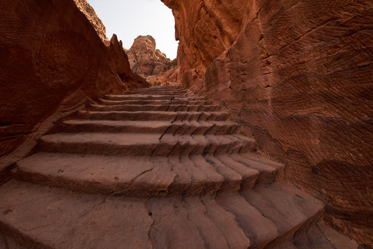 Flight of steps to achieve the treasury view from above inside the ancient city of Petra, Jordan