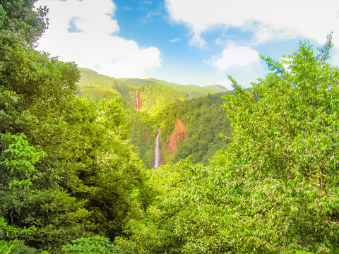 Scenic landscape in tropical rainforest of Carbet Falls or Les Chutes du Carbet, on Carbet River, Guadeloupe island, Caribbean, French Antilles. The waterfalls are one of the most popular landmarks.