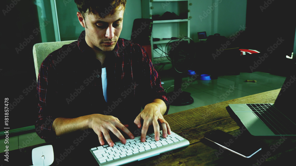 Fototapete A programer hacker trying to breached the computer security by using algorithm source code to exploit weakness in password security
