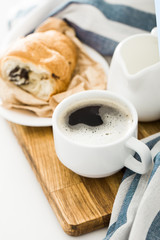 Morning coffee with croissant on the table