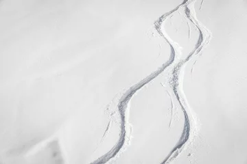Foto op Canvas Snowboard free ride tracks in fresh powder snow © marchello74