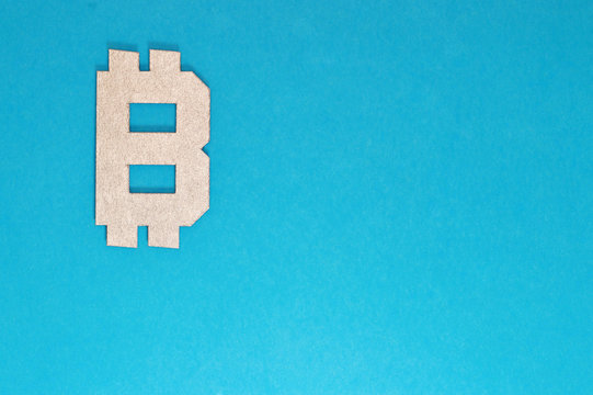 bitcoin currency symbol on blue background