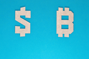 Obraz premium dollar and bitcoin currency symbol on blue background