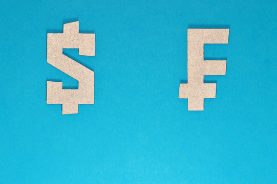 dollar and franc currency symbol on blue background
