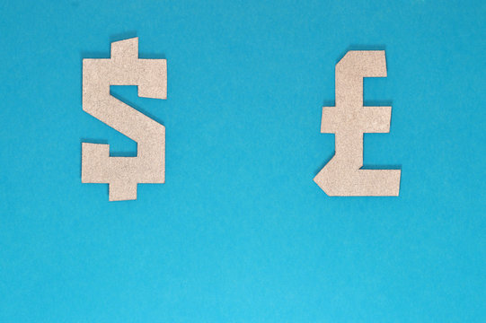 dollar and pound currency symbol on blue background
