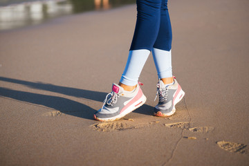 Fototapeta na wymiar Jogging sneakers on the beach