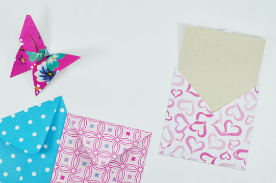 origami butterfly and decorated envelopes