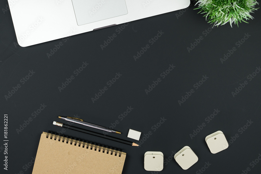 Poster Business office work desk table with computer laptop , note and stationery on black table background include copyspace for add text or graphic
