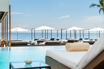Sofa beside swimming pool in beach resort during vacation in holiday at hua hin thailand