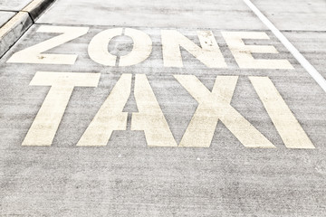  the line painted  in the asphalt for    taxy zone