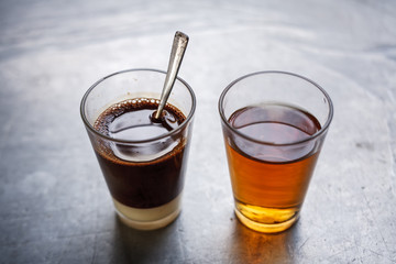 Traditional Thai coffee with chinese tea on side.