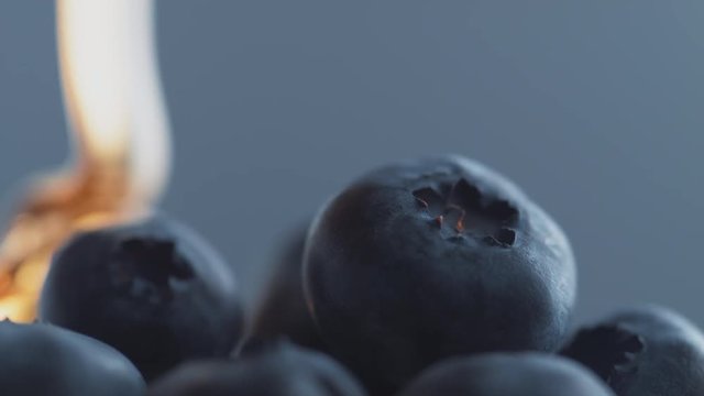 Thick honey dripping over blueberries.  Shot with high speed camera, phantom flex 4K. Slow Motion.