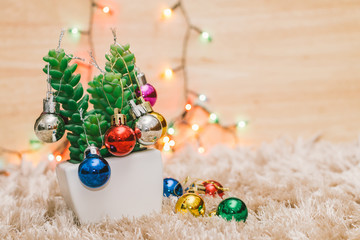 Christmas colorful ball decorative on tree with carpet , colorful bokeh light on background
