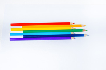 Color pencils, top view, white background