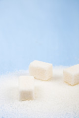 White sugar and cubes of sugar