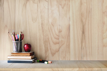 Back to school concept. School supplies on wood desk.