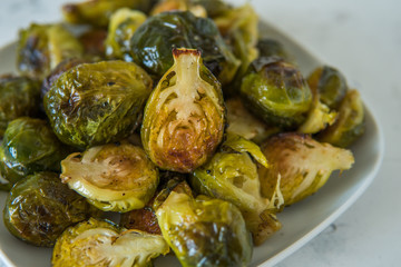 Cooked Brussels sprouts in a white plate