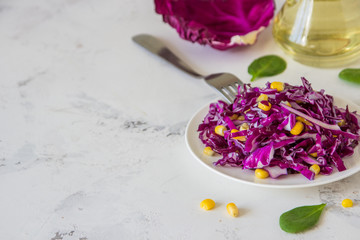 Fresh red cabbage salad with corn. Vegeterian and diet food. Space for text