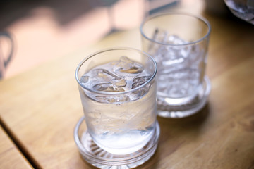 A glass of pure fresh water is poured into a glass