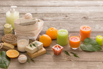 spa concept with orange fruits on old wooden background