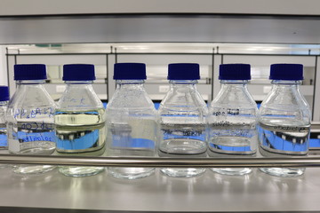 Reagent bottles with chemical in science classroom and laboratory.