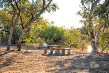 Picnic table beside the Diamantina River at Old Cork in rural Queensland