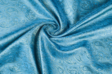 Background texture, pattern. Blue paisley silk chiffon mod fabric by the yard. Crinkled, flowy,...