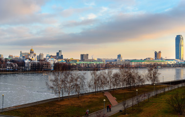 Fototapeta premium View of Iset river embankment on sunset. Yekaterinburg. Russia