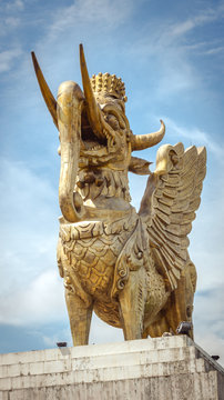 Lembuswana statue, Kutai's mythological animal who has head of lion with crown, elephant trunk, fish scales, and eagle wings, in a bright sunny day, Pulau Kumala, Tenggarong, Indonesia