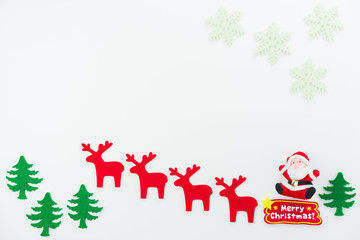 Christmas composition. Christmas tree, dear, Santa Claus on white background. Flat lay, top view