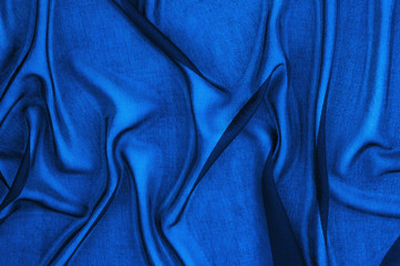 Texture, background, pattern. Blue transparent fabric. Crystal organza has a grainy shine and feel...