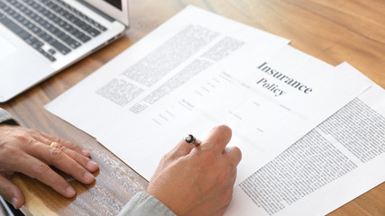 business man signing an insurance policy