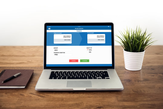 Business online banking sending and payment on the device using laptop computer.