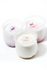 Obraz na płótnie Canvas assortment of yogurts with fruit additives, vertical