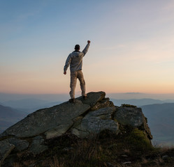 Obraz premium Hiker on top of mountain