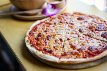 Hot pizza slice with melting cheese