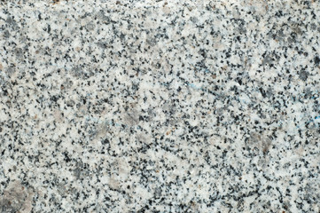 Texture, background, pattern. Granite stone. Padang Gray light gray granite with pronounced specks...