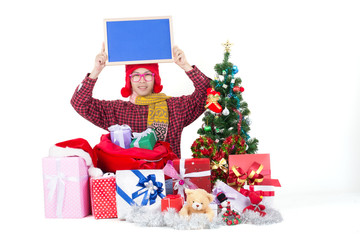 Young happy man with gift box around and holding blue sign for you text.